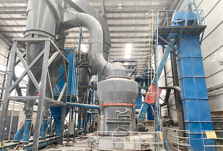Maintenance technician performing routine check on grinding mill components
